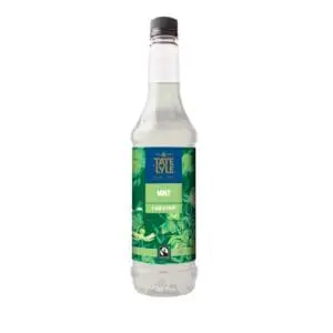 A bottle of water with green leaves and Tate & Lyle Fairtrade Mint Coffee Syrup 750ml on it.