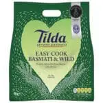 A package of Tilda Easy Cook Basmati & Wild Rice 4kg, displaying cooking instructions and health certifications.