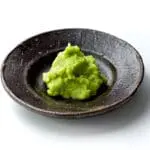 Wasabi paste on dark plate.