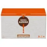 A box of NESCAFÉ Azera Americano Instant Coffee Sachets 200x2g with ground beans, featuring a red and brown logo on a gray textured background.