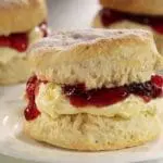 Cream tea scone with jam and cream.