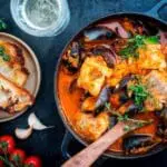 Spicy seafood stew with crusty bread.