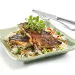 Grilled fish with rice and vegetables.