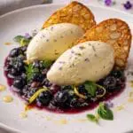 Lemon and lavender soft ice served with blueberry basil compote and almond tuiles, made using Arla Slower Melt Soft Ice Mix, recipe by Nicol Retailer