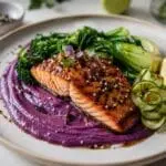 Miso glazed salmon with purple sweet potato purée and sesame greens. Recipe and image created by Nicol Retailer Limited