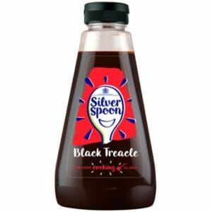 A bottle of Silver Spoon Black Treacle Squeezy 1 x 680g on a white background.