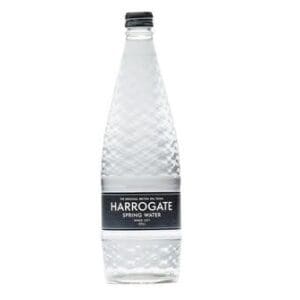 A bottle of Harrogate Spring Water Still 12 x 750ml with a label on it.