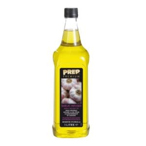 A bottle of garlic oil on a white background, perfect for Christmas sauces.