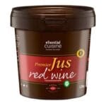 An Essential Cuisine Red Wine Jus 1kg container on a white background.