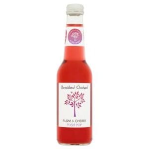 12x275ml of Breckland Orchard Plum & Cherry Posh Pop on a white background.