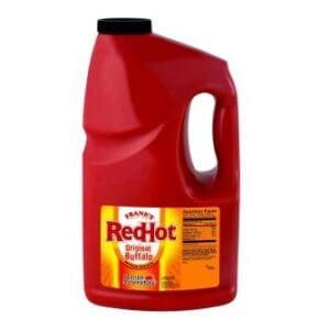 A large red plastic jug of Frank's RedHot Buffalo Wing Sauce 3.78ltr on a white background.