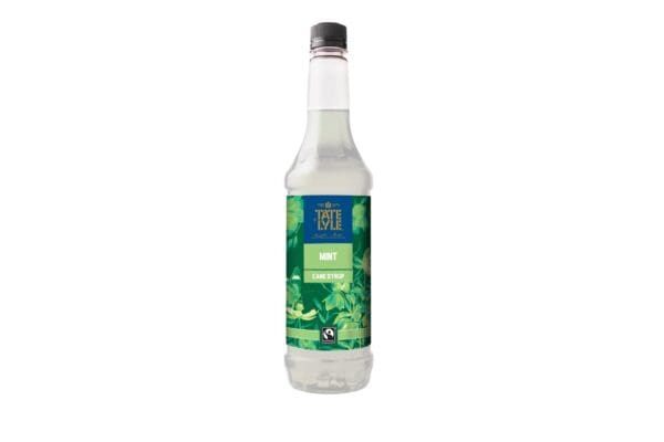 A bottle of water with green leaves and Tate & Lyle Fairtrade Mint Coffee Syrup 750ml on it.