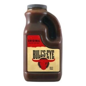A plastic bottle of Bulls Eye Original BBQ Sauce 2ltr with a red and yellow label, isolated on a white background.
