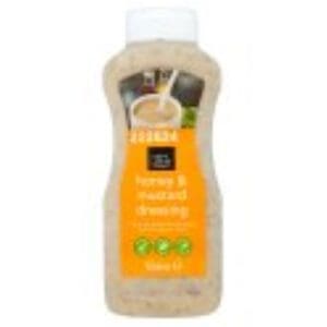 Plastic bottle of brown vegan natural shampoo with an orange label, featuring eco-friendly symbols and text describing Chef's Larder Honey & Mustard Dressing 1 Litre scent.