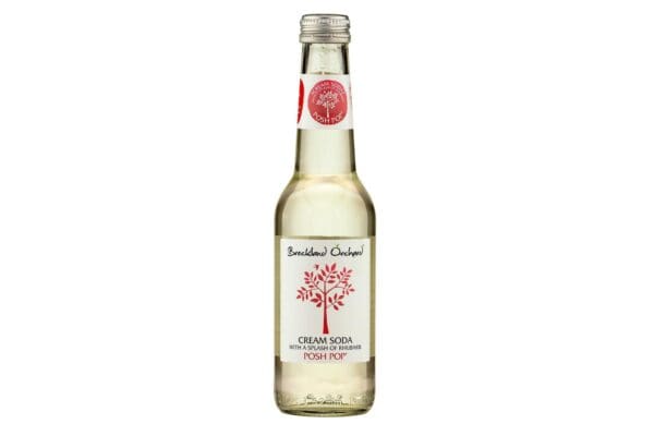 A clear glass bottle of Breckland Orchard Cream Soda with a splash of Rhubarb 12x275ml, featuring a red and white label with a tree design, isolated on a white background.