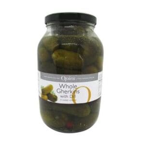 A jar of Opies Whole Gherkins with Dill in Sweet Vinegar 1.9kg, showing green pickles visible through the clear glass container with the product label.