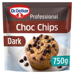 A packet of Dr Oetker Professional Dark Chocolate Chips 50% 750g, with a muffin sprinkled with Dr Oetker Professional Dark Chocolate Chips 50% 750g on a plate.