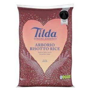 A package of Tilda Arborio Risotto Rice 5kg with a heart-shaped design containing grains, emphasizing its use for risotto.