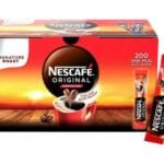 Packaging of Nescafe Original Instant Coffee Sachets 200x1.8g with a sachet displayed in front, against a sunrise background.