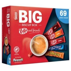 Large red box labeled "Nestlé Big Biscuit Box 1 x 1.357kg" with an assortment of chocolate bars including KitKat and others, next to a cup of coffee.
