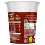 A cup printed with "Pot Noodle Beef & Tomato 12x90g" nutritional information and recycling symbols, featuring bold text and contact details.