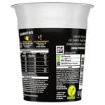 Instant noodle cup labeled as Pot Noodle Bombay Bad Boy 12x90g, showing nutritional information, recycling symbols, and barcodes on its label.
