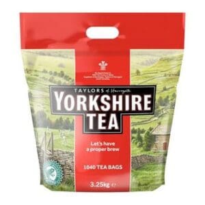 A pack of Yorkshire Tea Bags Pack of 1040 containing 1040 tea bags, featuring a scenic Yorkshire landscape on its packaging.