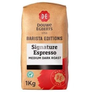 A Douwe Egberts Barista Editions Signature Coffee Beans 1kg, medium dark roast coffee, in a brown package with black and red accents.