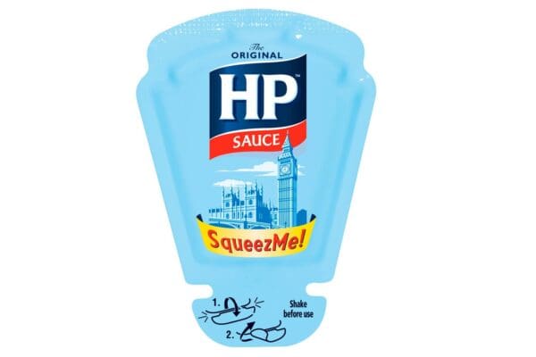 A plastic squeeze bottle of HP SqueezMe! The Original Sauce 70x26ml featuring an illustration of Big Ben and the Houses of Parliament on a blue background.