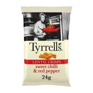 A bag of Tyrrells lentil crisps in sweet chilli and red pepper flavor, featuring 24g weight indication and a monochrome image of a woman preparing food in the background.