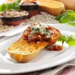 Baked butternut squash with bean topping.