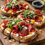 Bresaola tartine with roasted sweet peppers, lemon ricotta and rocket.