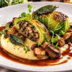 Savoy cabbage parcel with wild mushroom and chestnut duxelles, truffle potato purée, roasted mushrooms and caramelised onion jus